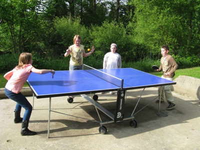 English family playing table tennis